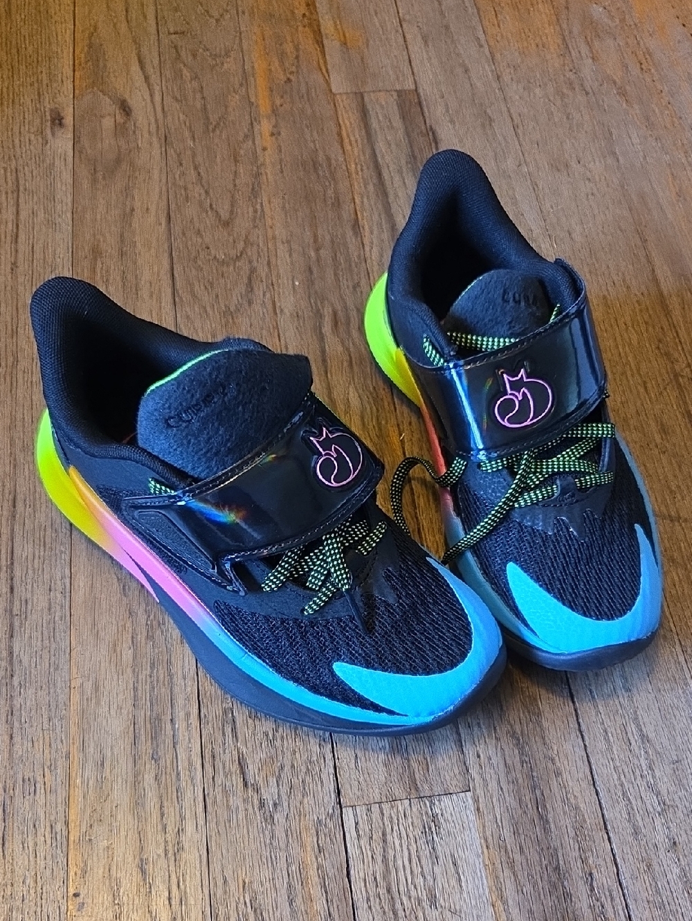 Under Armour Kids Black Basketball Sneakers with Blue and Neon Rainbow Accents